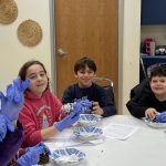 4th & 5th grade students help kindergarten & 1st grade students make bird feeders